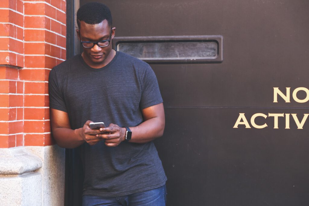 Black Man Using Phone Social Media