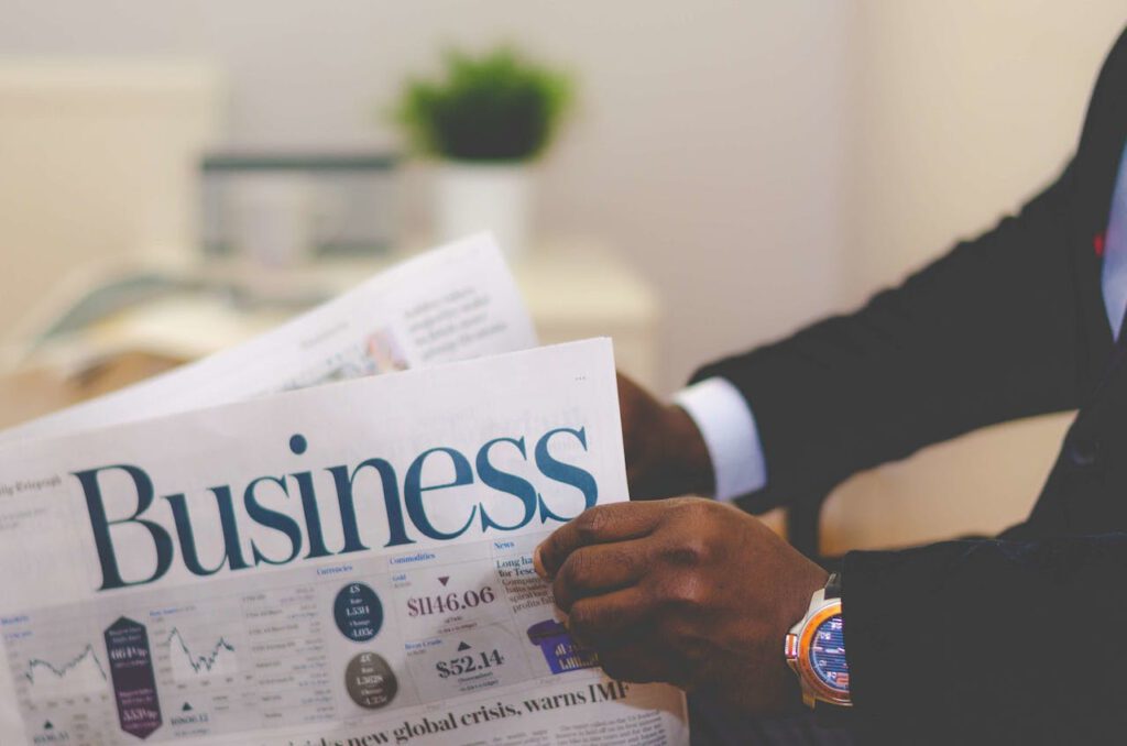 Black Person Holding Business Magazine