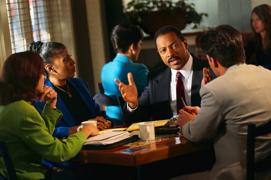 Black business people on a table