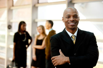 Happy black businessman smiling