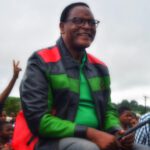 Lazarus Chakwera Wearing Mcp Leather Jacket