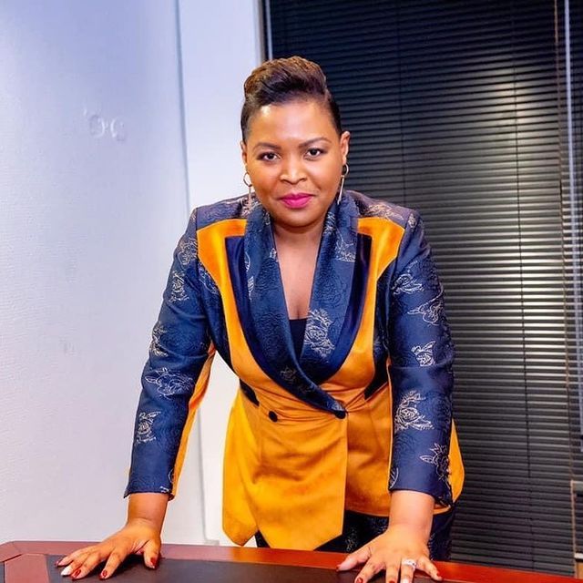 Mary Bushiri Wearing Orange Blue Outfit