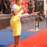 Mary Bushiri Wearing Yellow Dress With High Heels