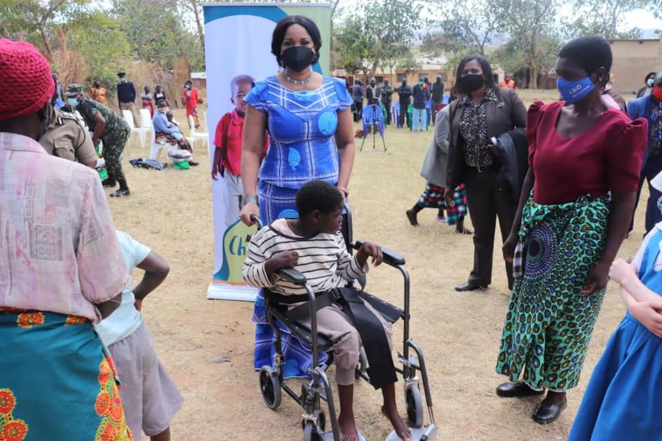 Mary Chilima Helping A Child