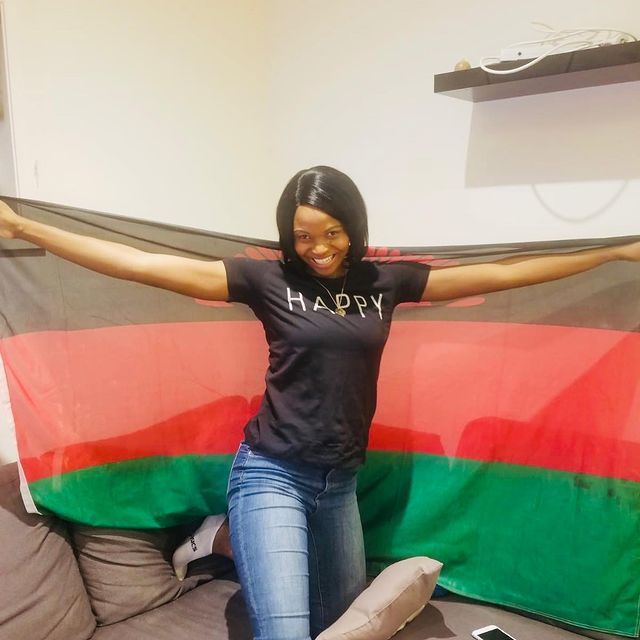 Mwai Kumwenda With Malawian Flag