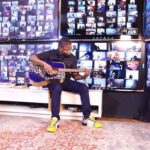 Shepherd Bushiri Playing Guitar