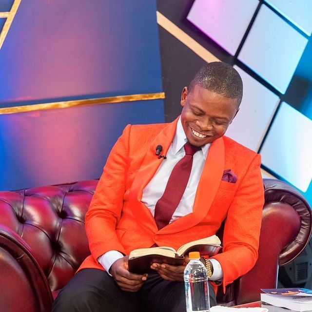 Shepherd Bushiri Smiling As He Reads Bible